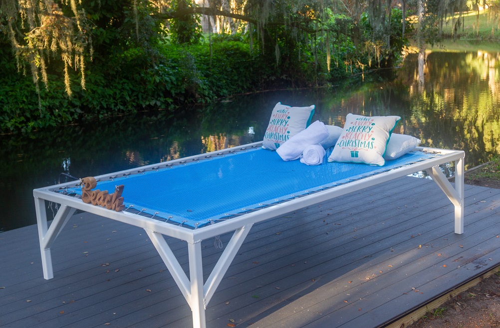 A Daybed with a white frame and coated polyester mesh net in light blue with a light blue border.